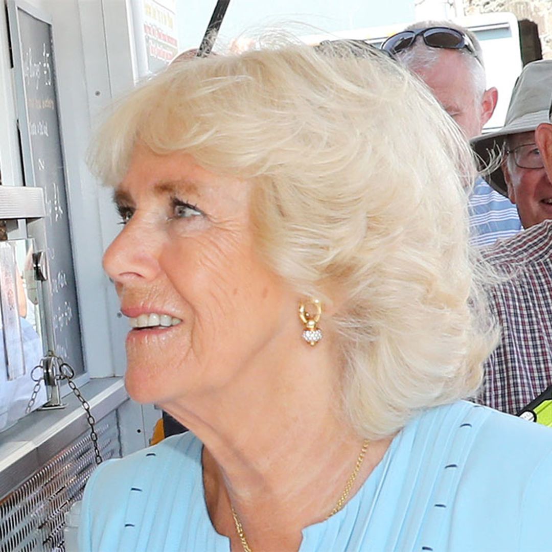 The Duchess of Cornwall stuns in pastel blue as she joins Prince Charles in Cornwall