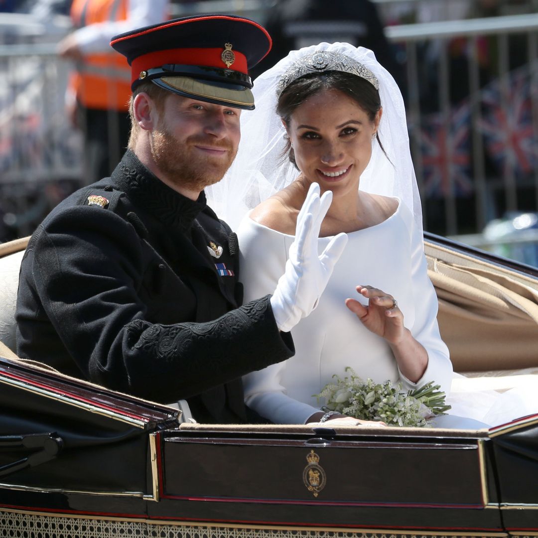 Prince Harry and Meghan Markle in their wedding carriage