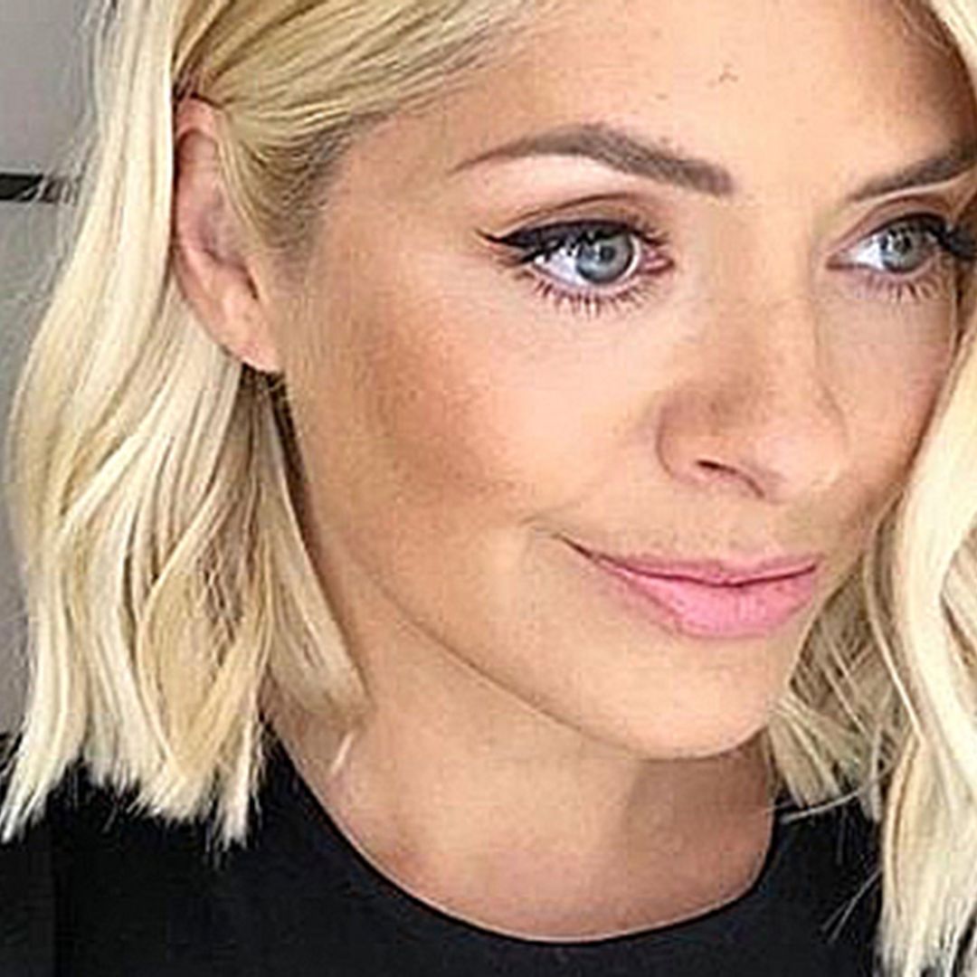 Holly Willoughby models M&S mini dress in bedroom photo