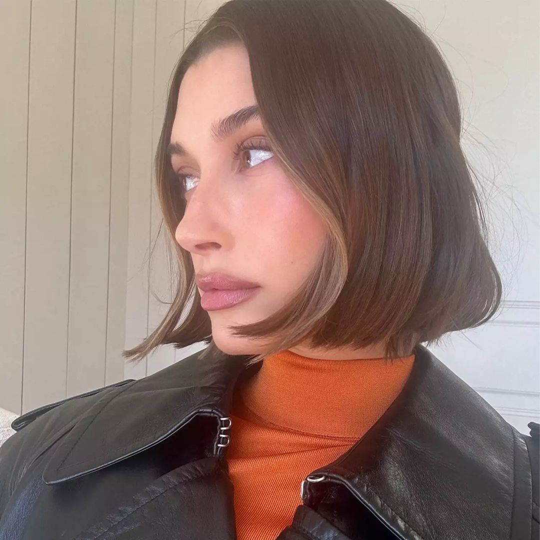 Hailey biber with an italian bob and orange turtle neck