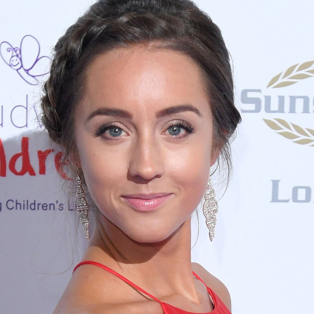 Emily Andre stuns in fabulous winter-chic overcoat for latest video