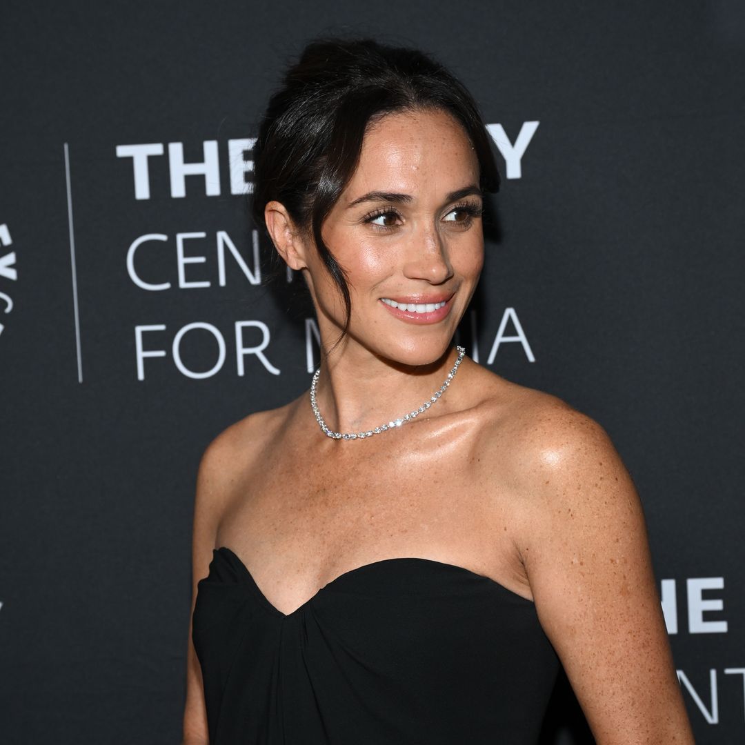 Meghan Markle stuns in plunging, bridal-inspired dress for Instagram return