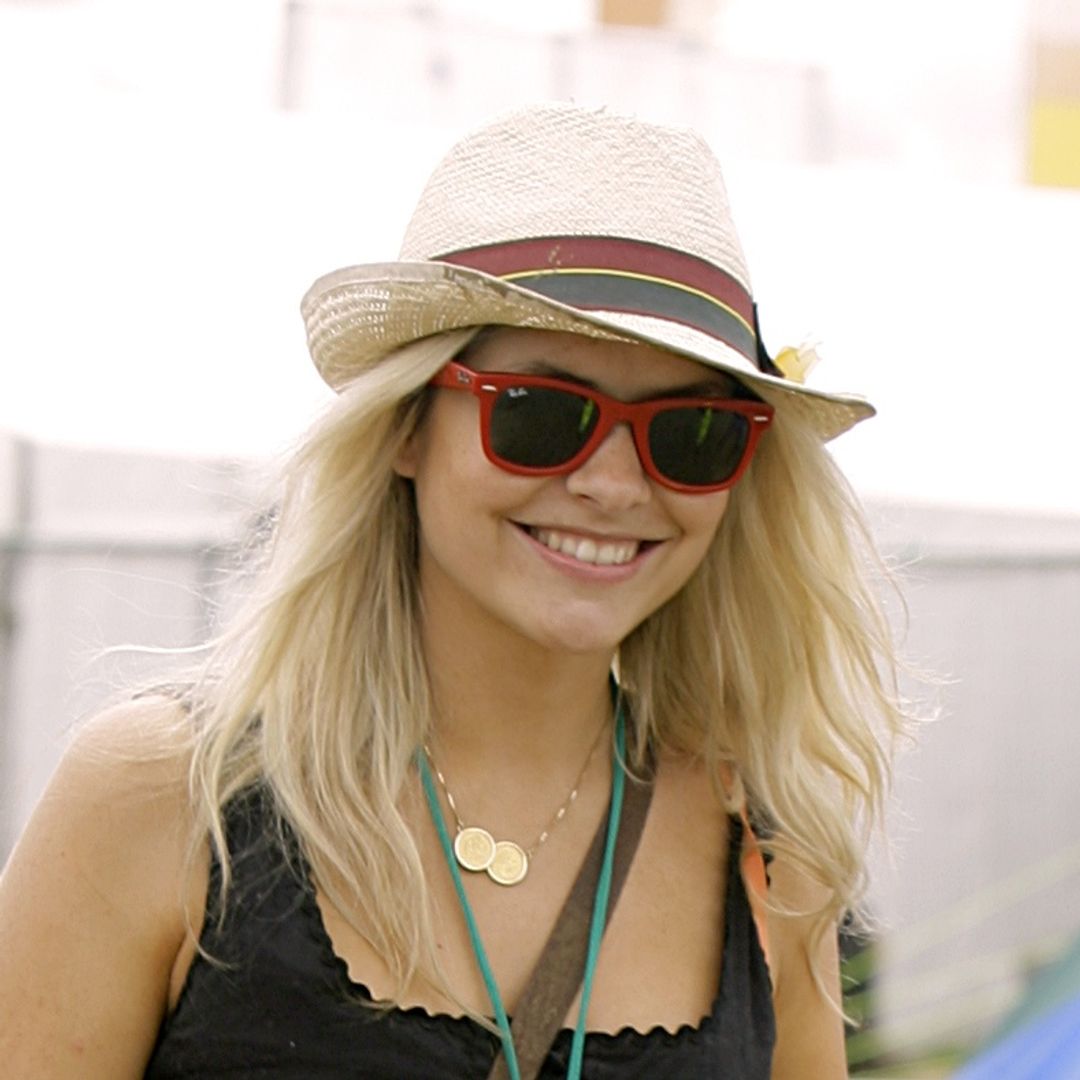 Holly Willoughby goes undercover at Glastonbury in white mini dress and cowgirl boots