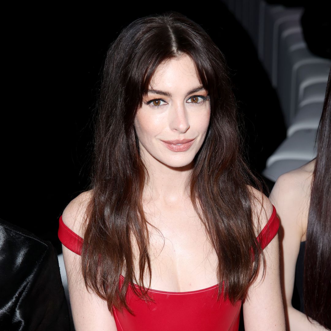 Anne Hathaway sizzles in skintight PVC dress in jaw-dropping new photos