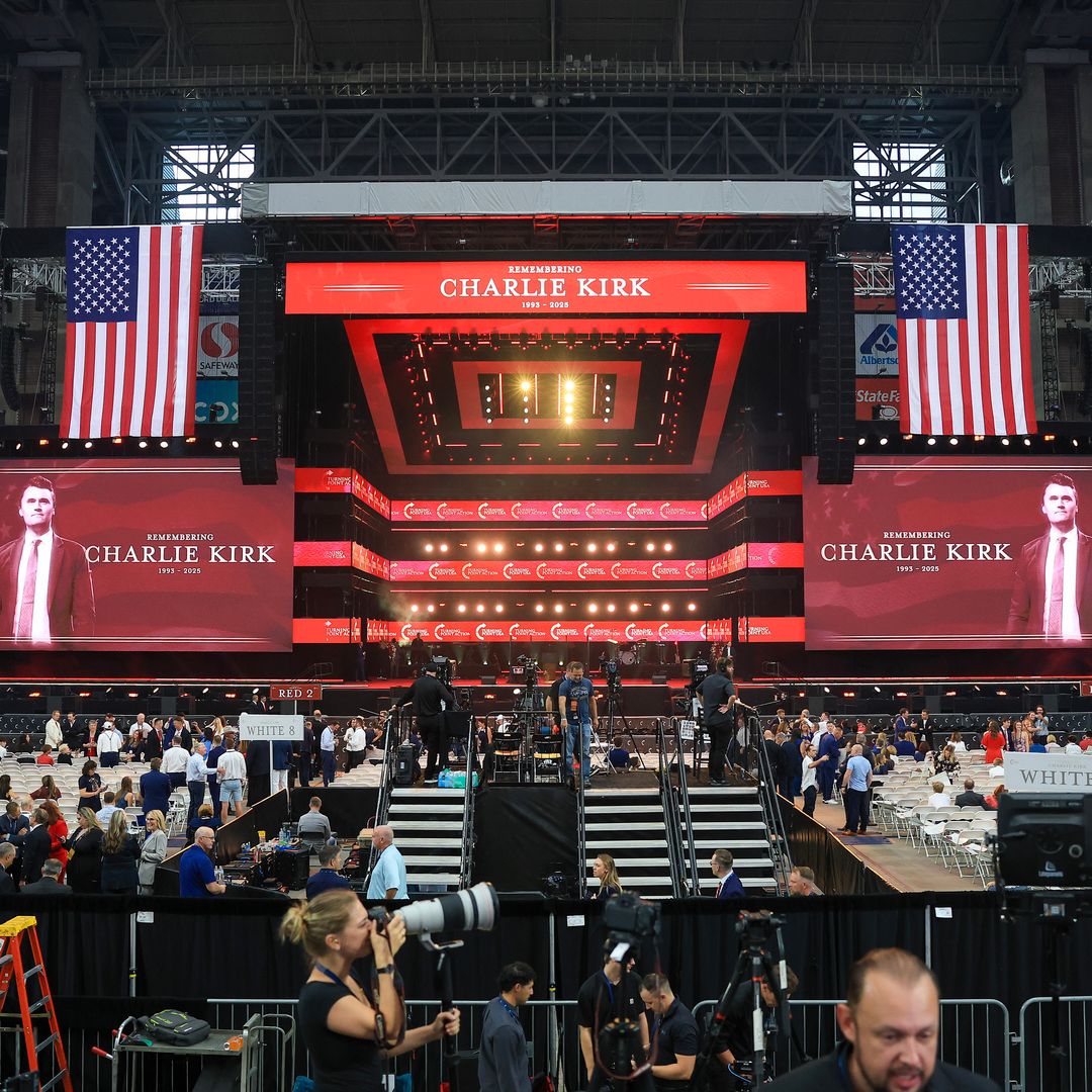 Attendees gather in the stands as media set up ahead of the memorial service for political activist Charlie Kirk at State Farm Stadium on September 21, 2025 in Glendale, Arizona. Kirk, the CEO and co-founder of Turning Point USA, was shot and killed on September 10th while speaking at an event during his "American Comeback Tour" at Utah Valley University