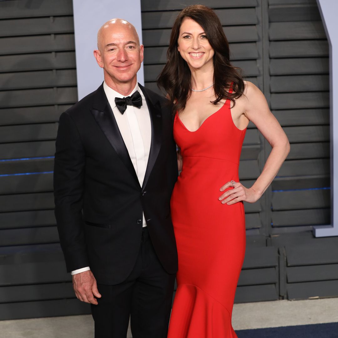 Jeff Bezos and MacKenzie Bezos smiling for a photo on a red carpet