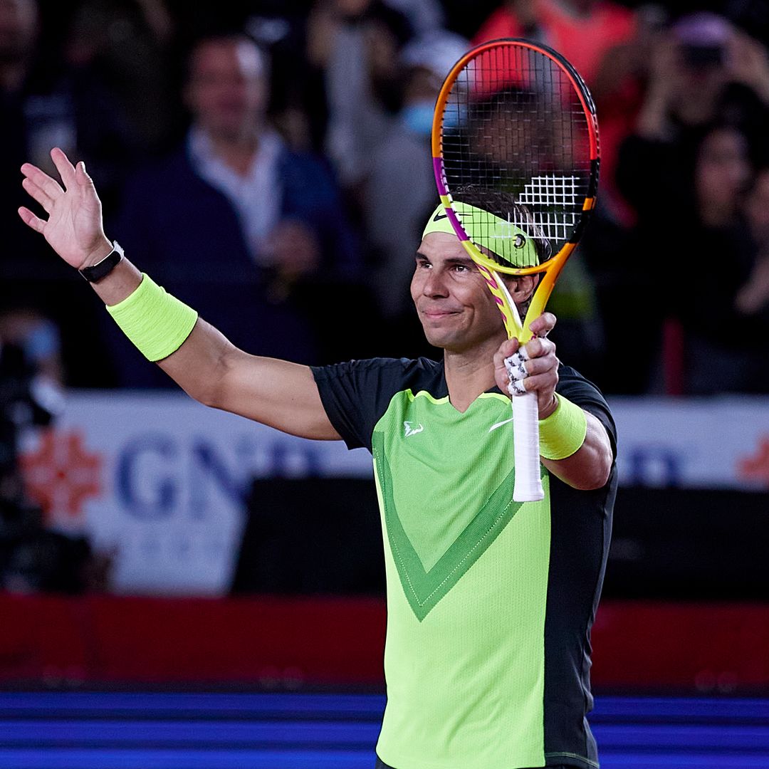 man on tennis court with racket
