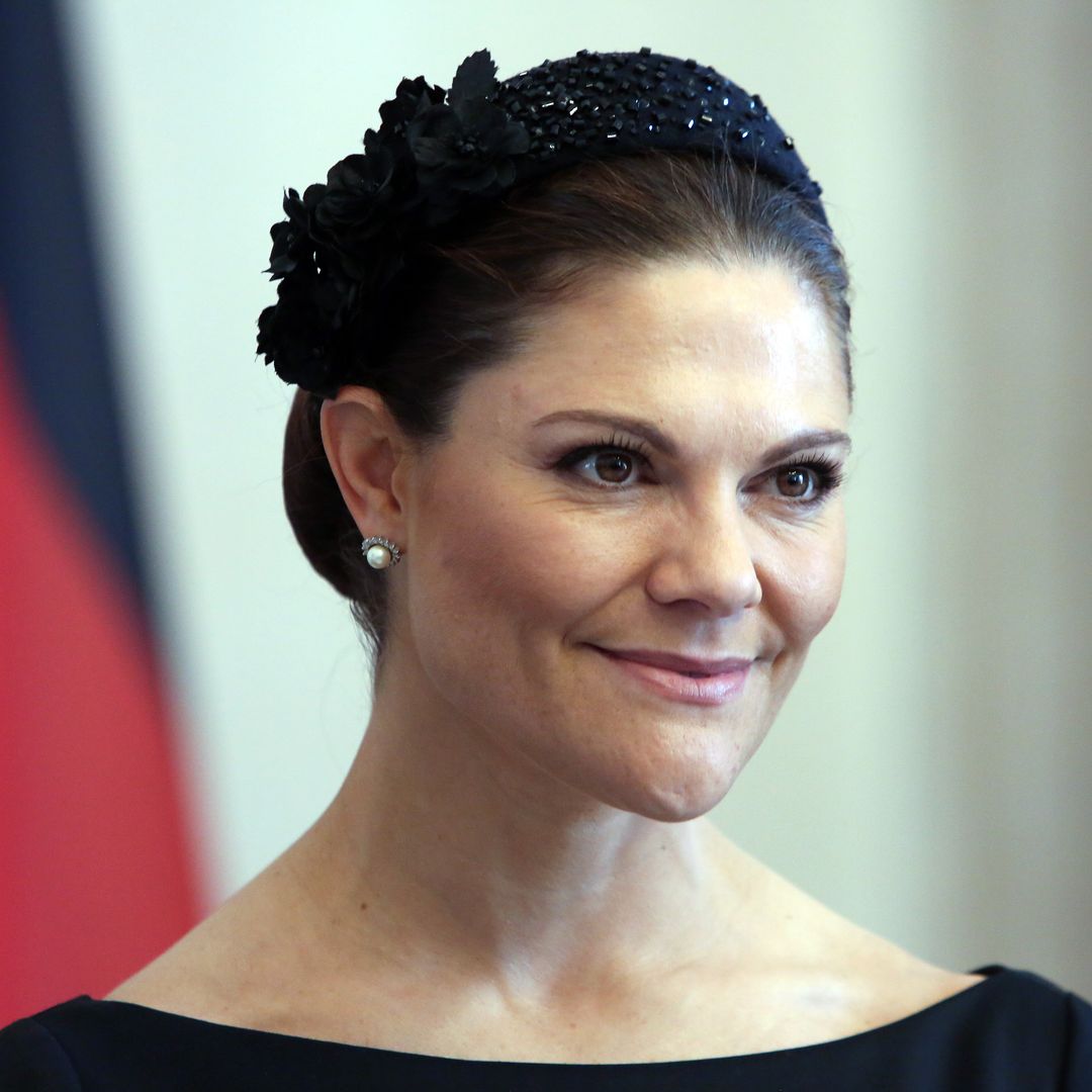 Crown Princess Victoria wows in slinky feathered gown for glitzy evening with Princess Kate