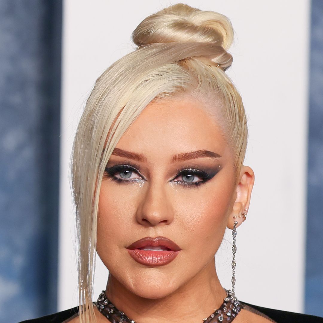 Christina Aguilera is unrecognizable in risque leather corset for incredible Halloween transformation