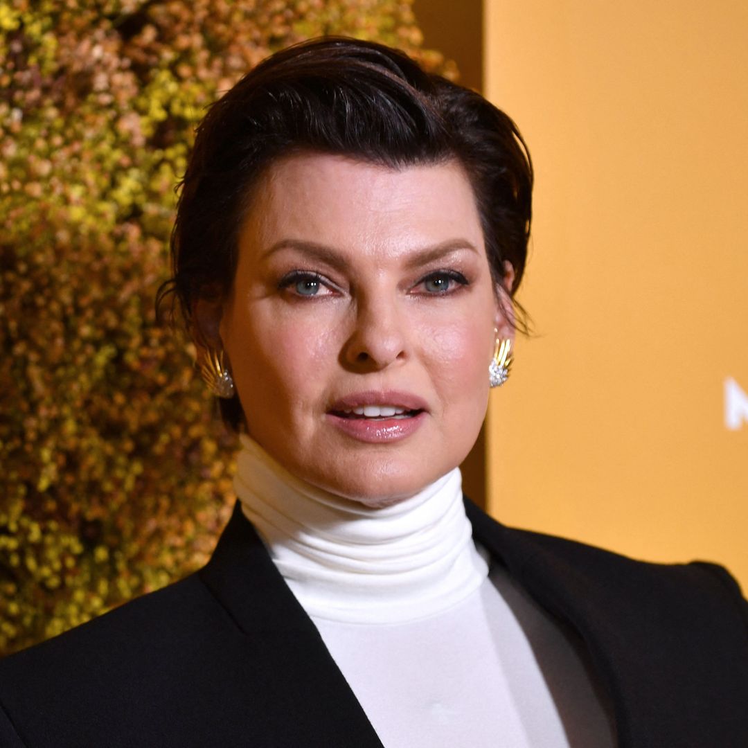Linda Evangelista holds onto teen son for incredibly rare red carpet appearance