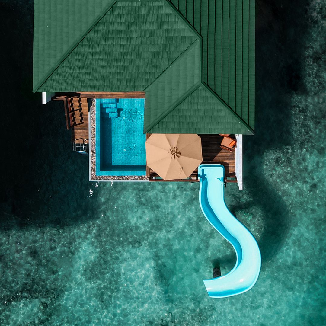 Maldives birds eye shot with slide into water