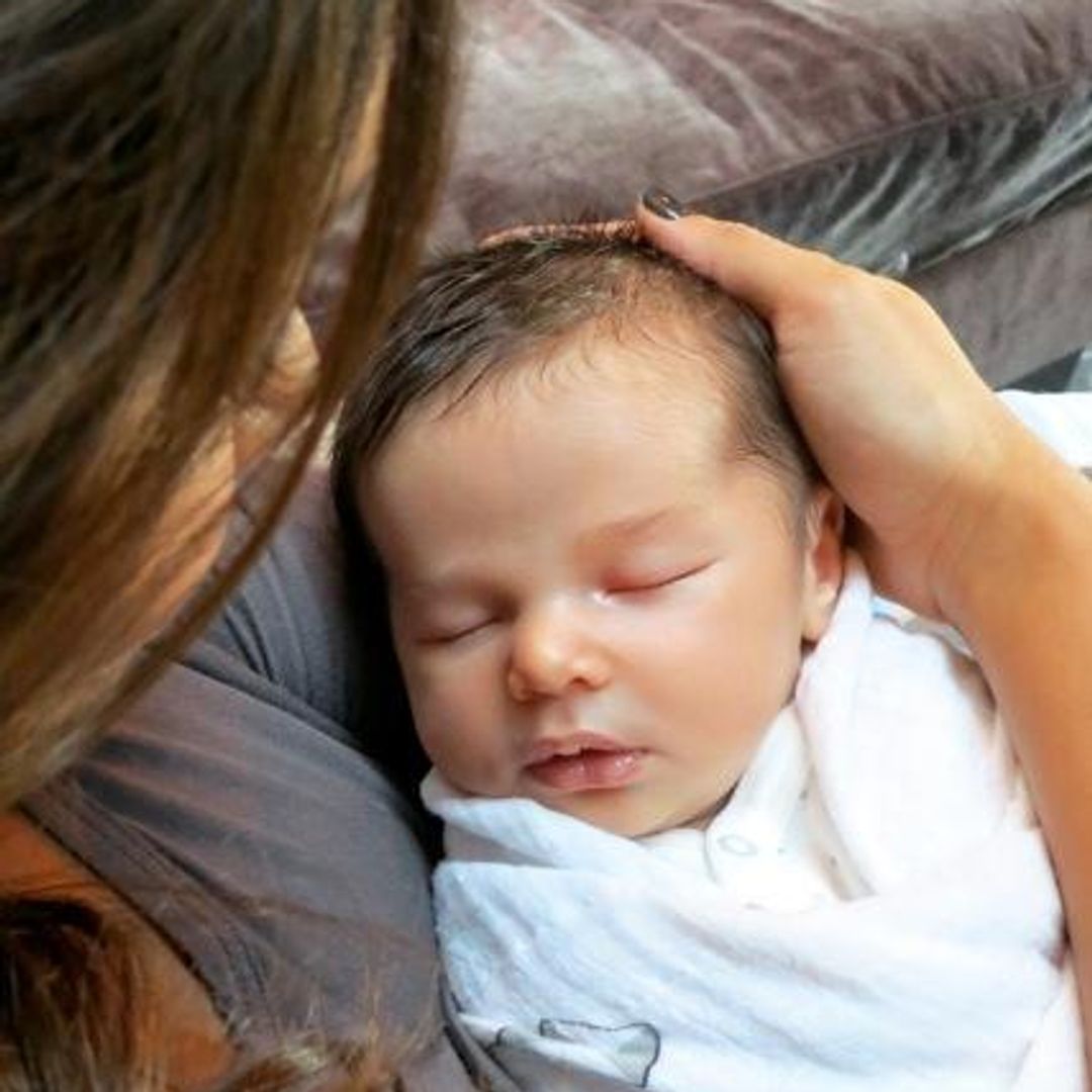 A photo of a newborn Camden in Vanessa's arms