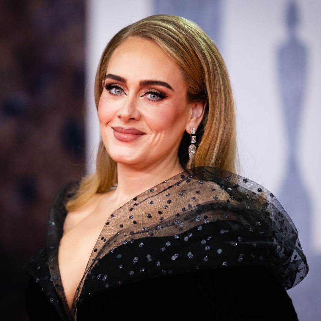 Adele looks sensational in jaw-dropping tight black dress for Pride