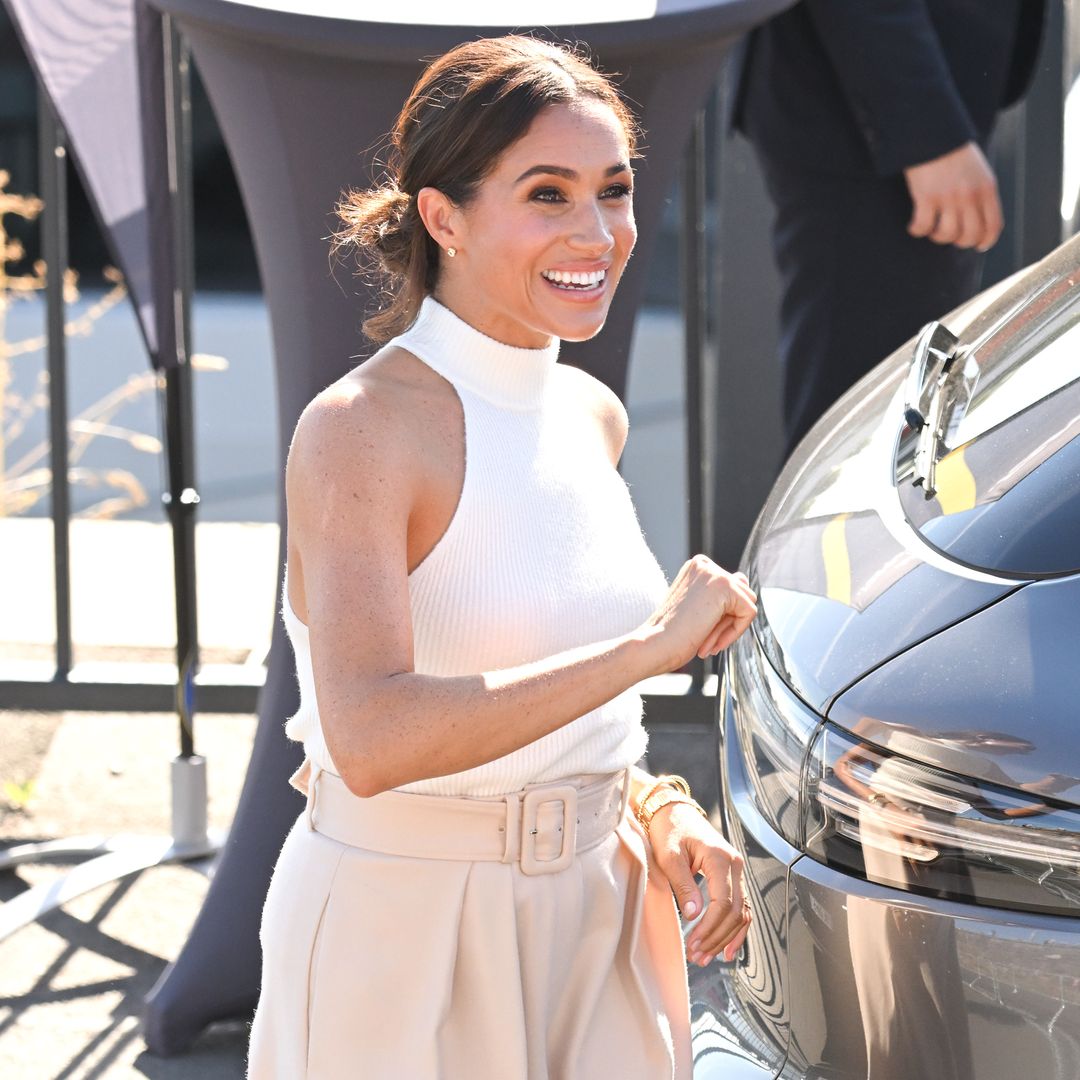 Radiant Meghan Markle looks beautiful in Valentino power suit in new footage