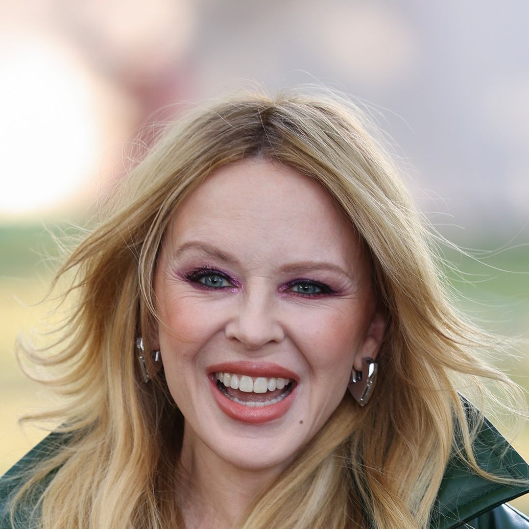 Kylie Minogue poses in cheeky bathrobe for 'wedding' photo - but it's not what you think
