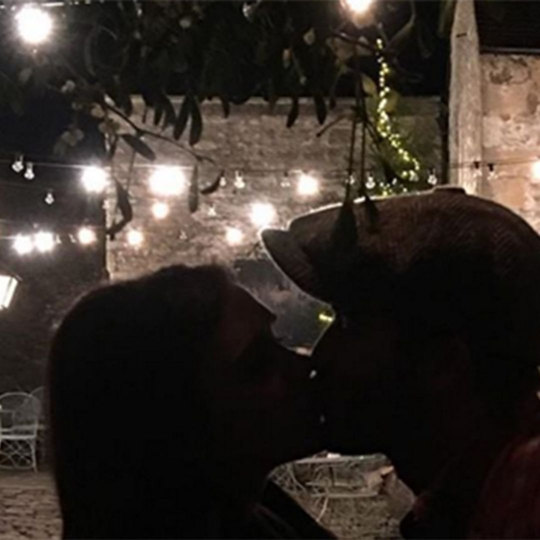 David and Victoria Beckham share Christmas kiss under the mistletoe