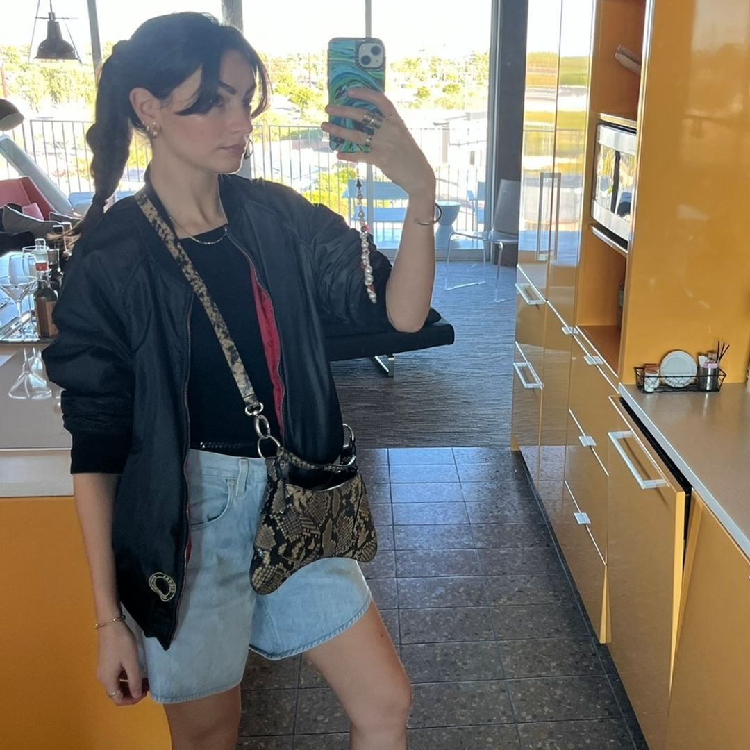 brunette girl in Citizens of Humanity jorts and cowboy boots