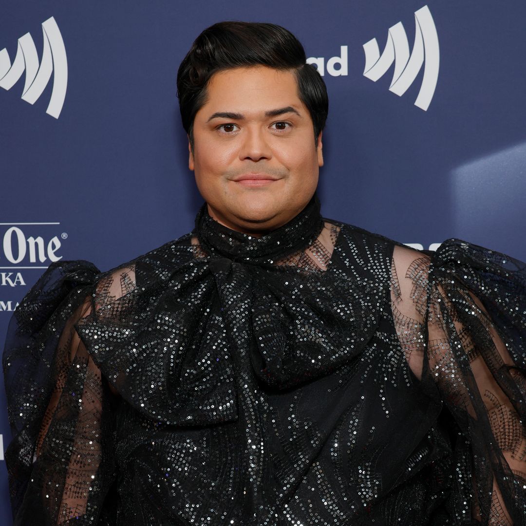 What We Do in the Shadows' Harvey Guillen smiling on a red carpet