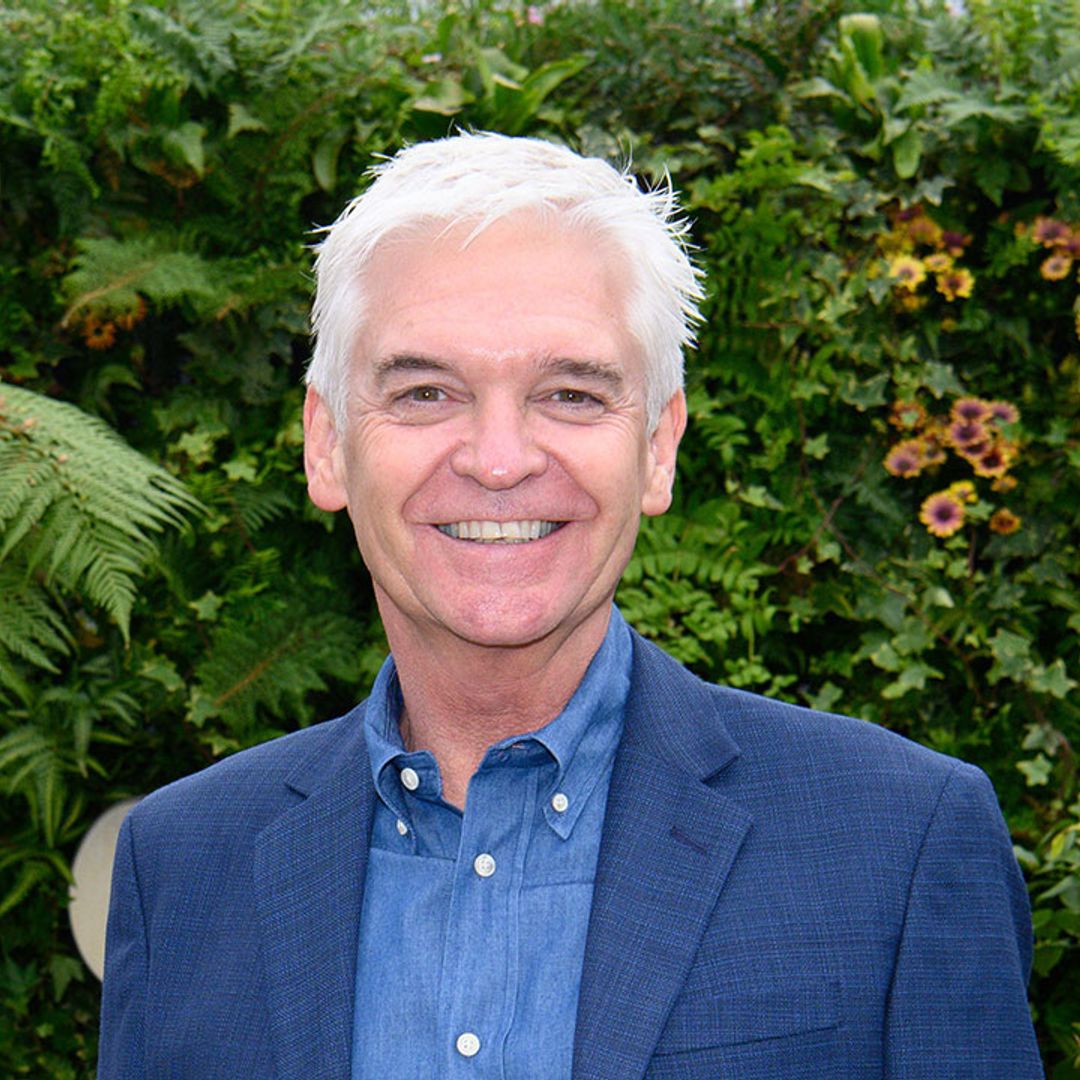 Phillip Schofield beams as he cuddles up in magical garden at London home