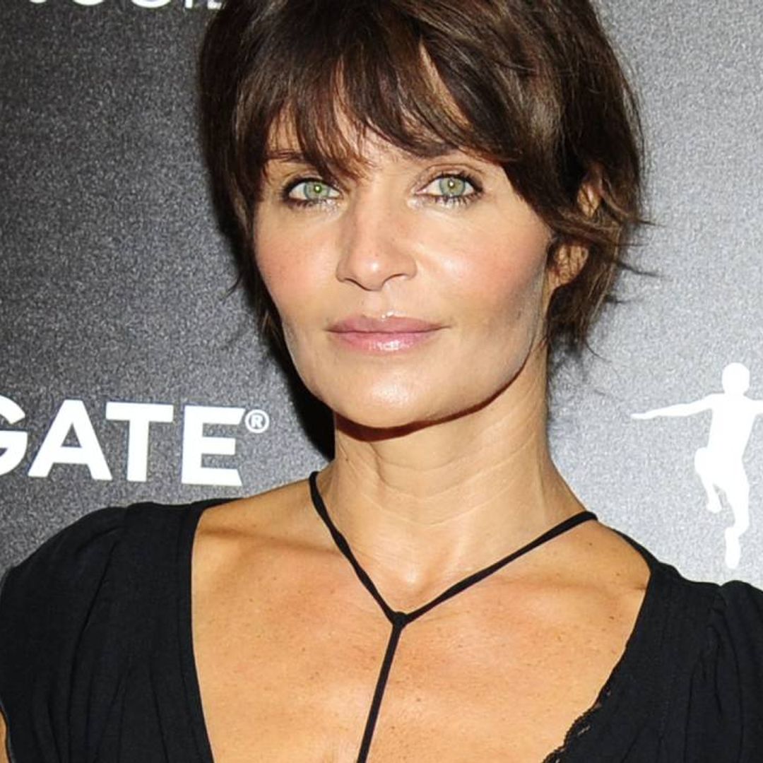 Helena Christensen models crocheted cutout swimsuit - and her legs are endless