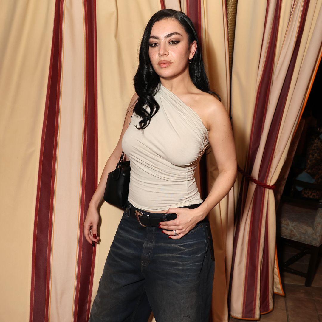 Charli XCX nails grunge glam in draped top and boyfriend jeans