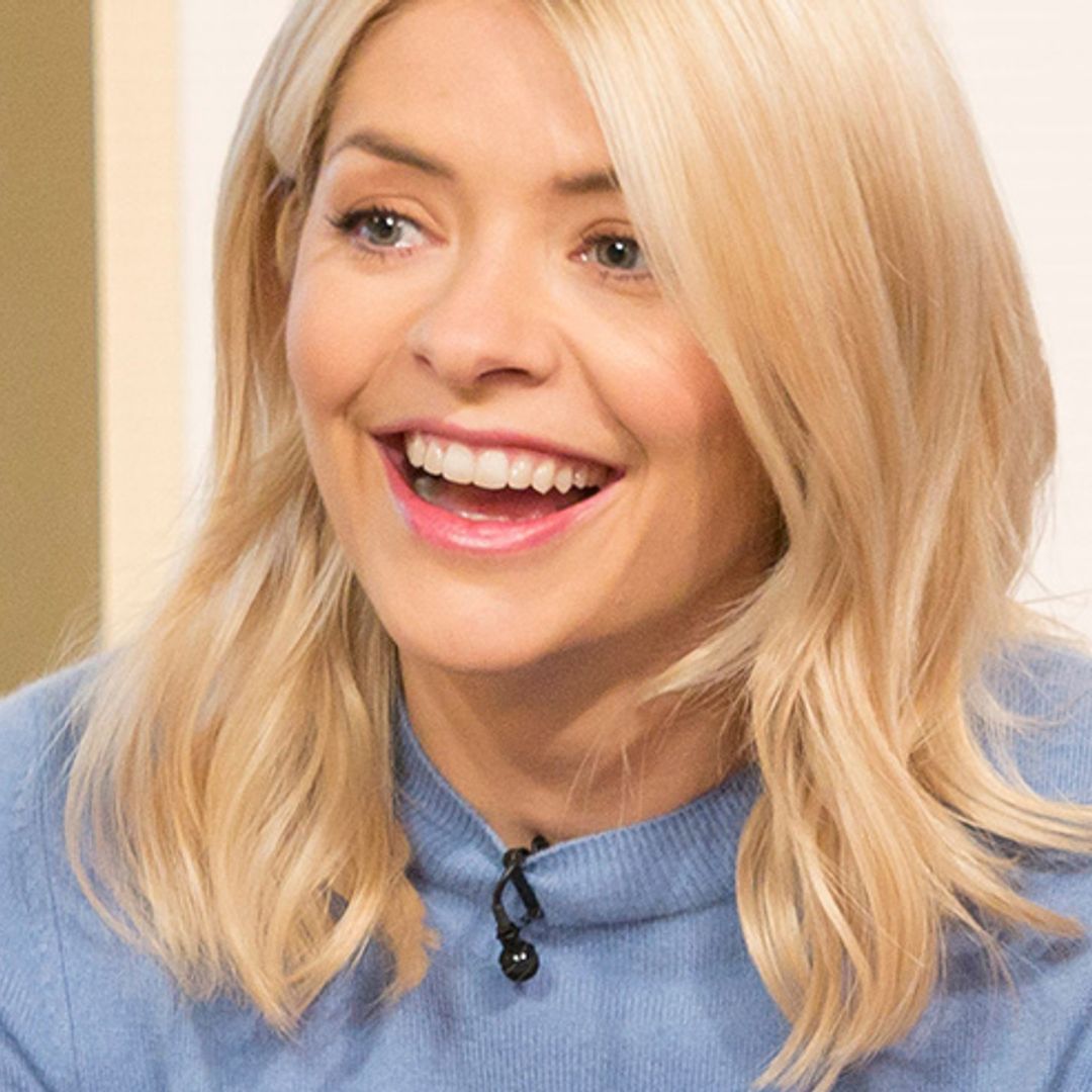 Holly Willoughby shocks fans as she matches her red boots with red mini skirt