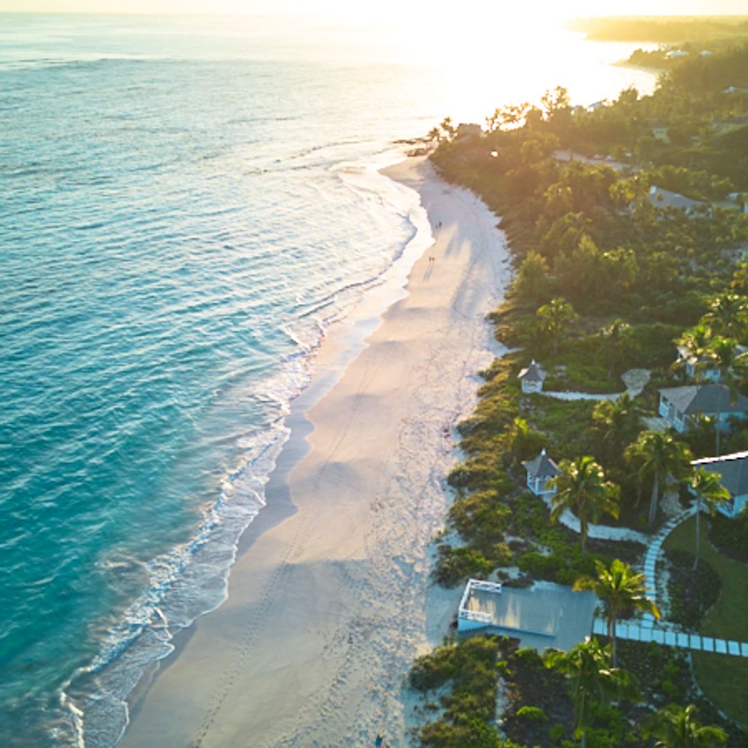 aerial shot of shores and luxury villas on island of Bahamas