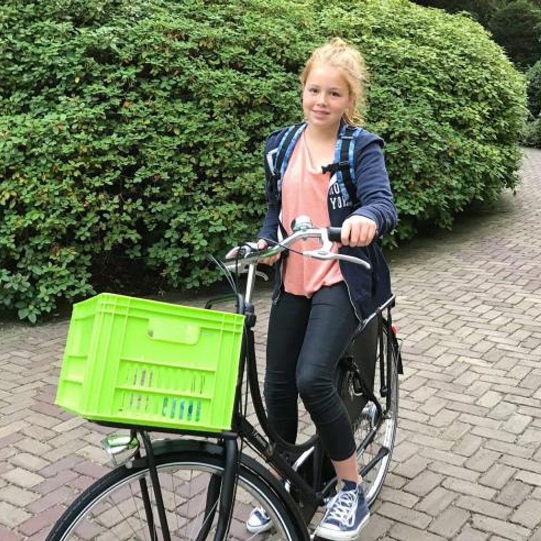 Princess Alexia of the Netherlands cycles to school on first day back – watch the video