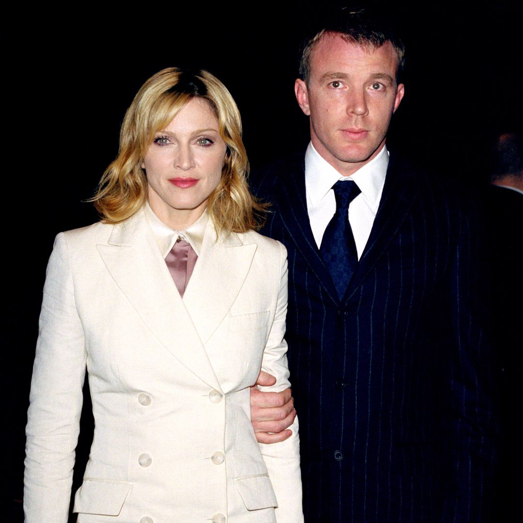 Madonna and Guy Ritchie smiling at an event