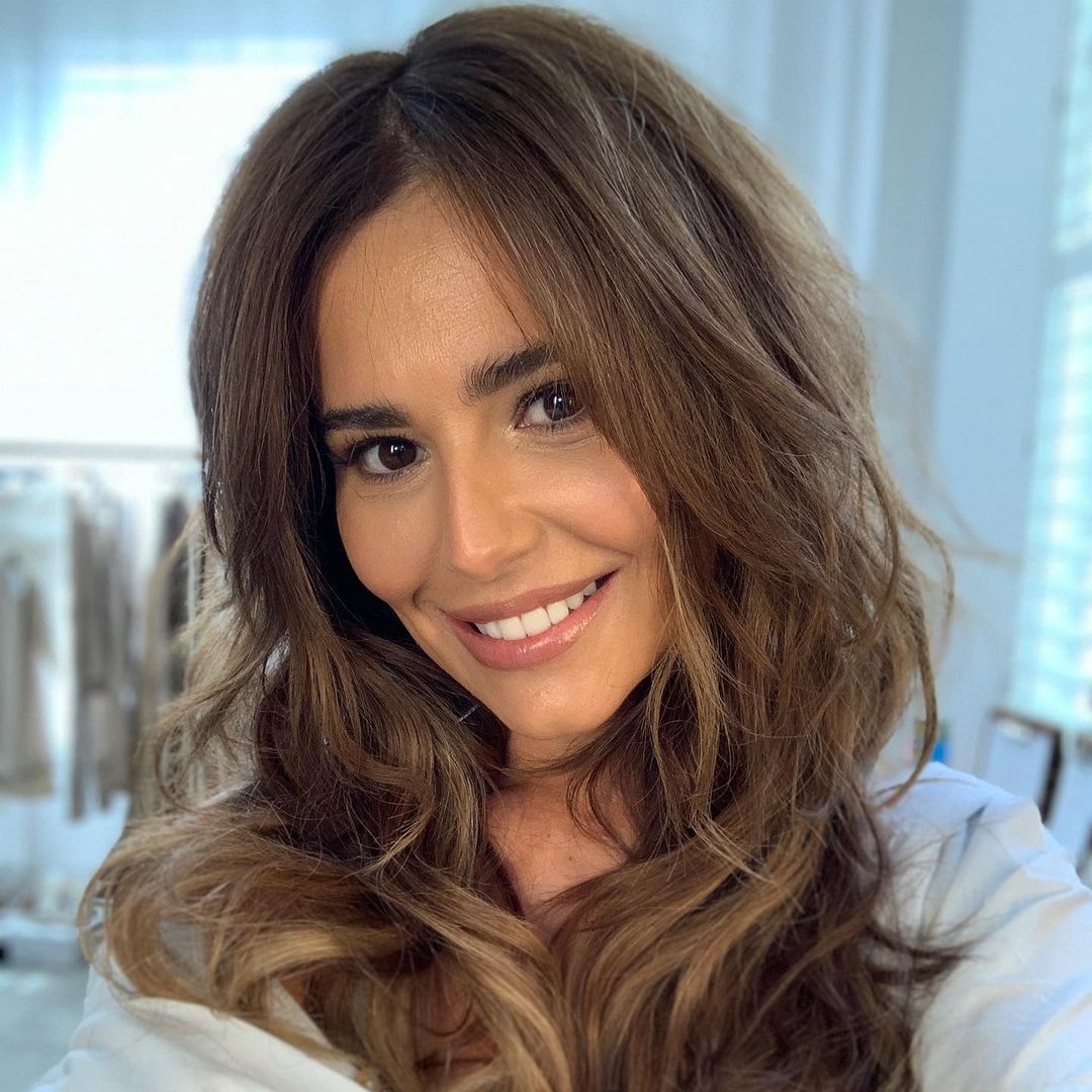 Youthful Cheryl stuns in figure-flattering trousers for 'emotional' reunion