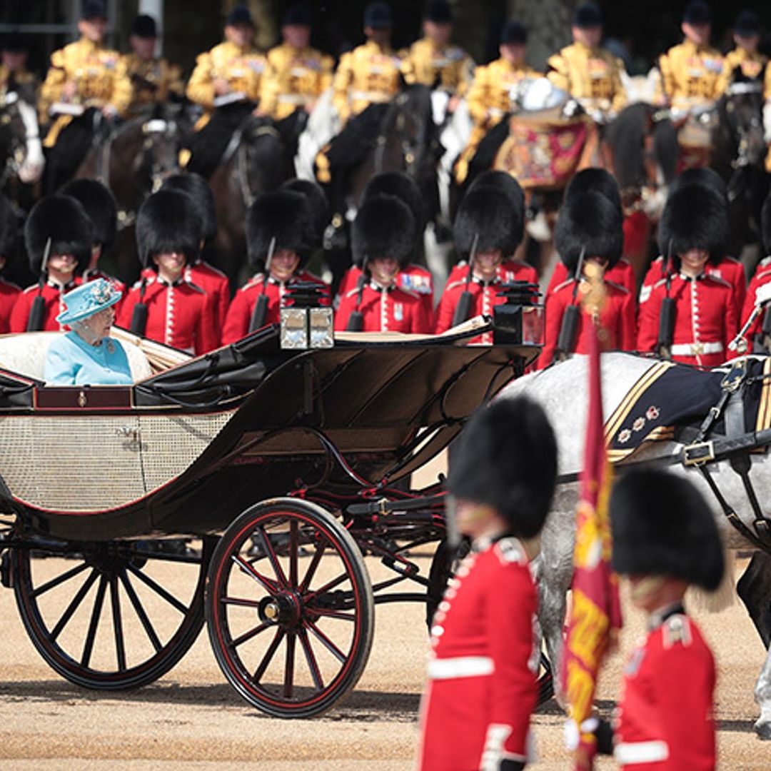 The Queen rides carriage alone at Trooping the Colour as Prince Philip misses parade