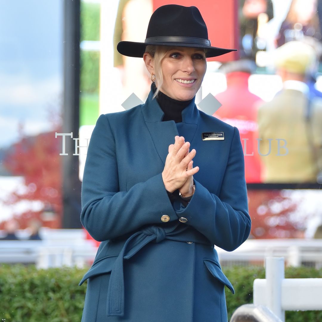 Zara Tindall looks endlessly stylish in petrol blue coat and fabulous boots at Cheltenham Racecourse