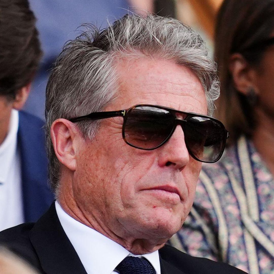 Hugh Grant takes a nap while watching tennis in the royal box – video