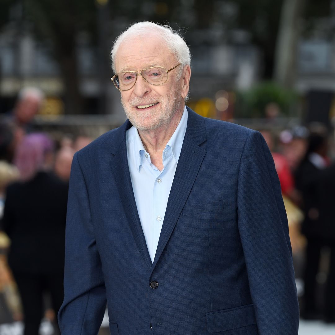 Michael Caine, 92, uses wheelchair to accept award in rare public appearance as wife and daughters support star