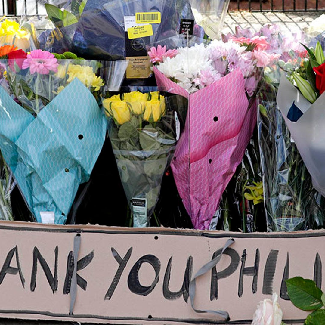 Mourners leave notes and tributes outside the royal palaces following the death of Prince Philip