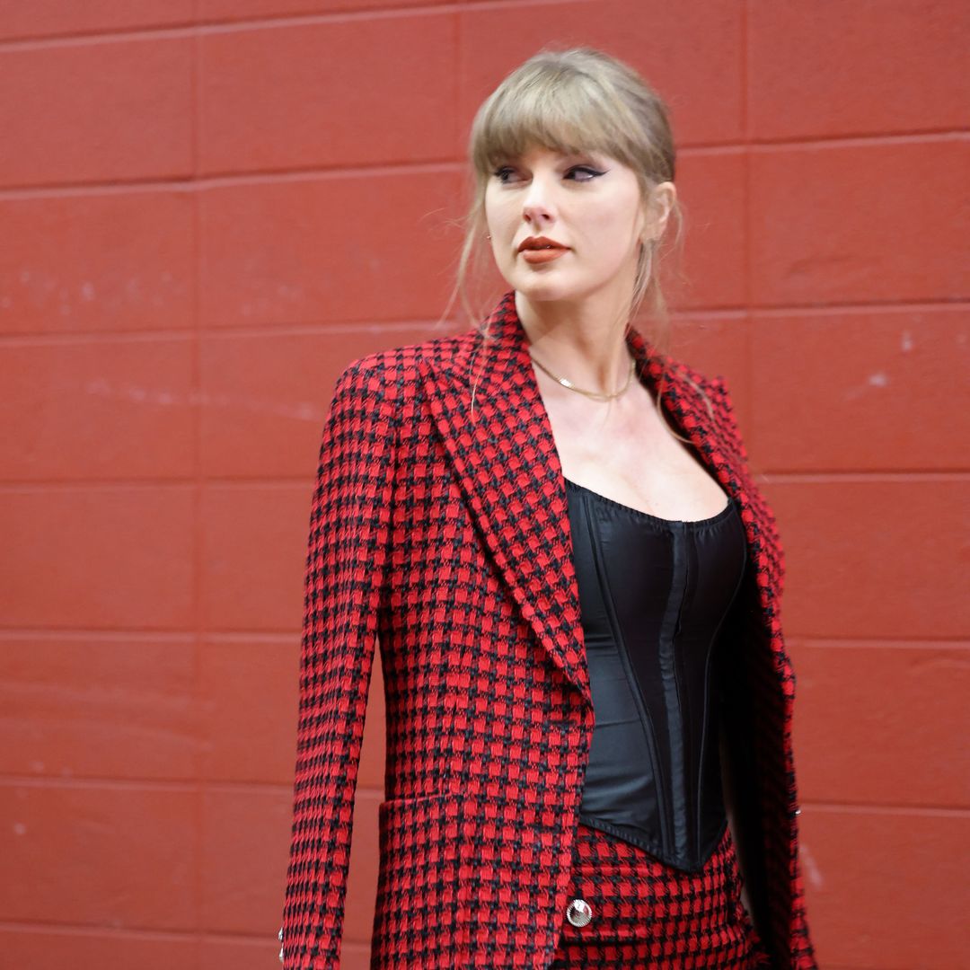 Taylor Swift shows she means business in $5K red Versace suit as she supports Travis Kelce