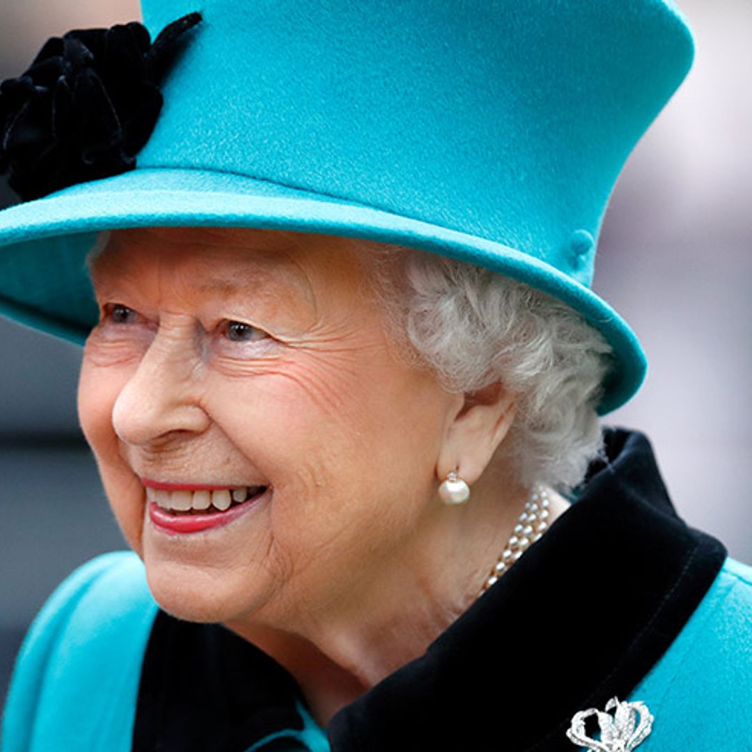 The Queen surprises in the ultimate Burberry accessory and we just love it