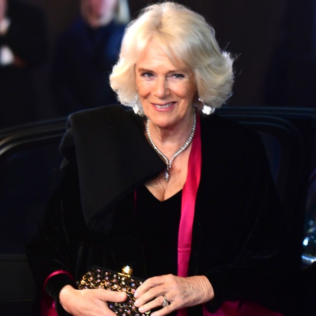 The Duchess of Cornwall looks stunning in floor-length black velvet evening gown by Bruce Oldfield at 1917 film premiere with Prince Charles