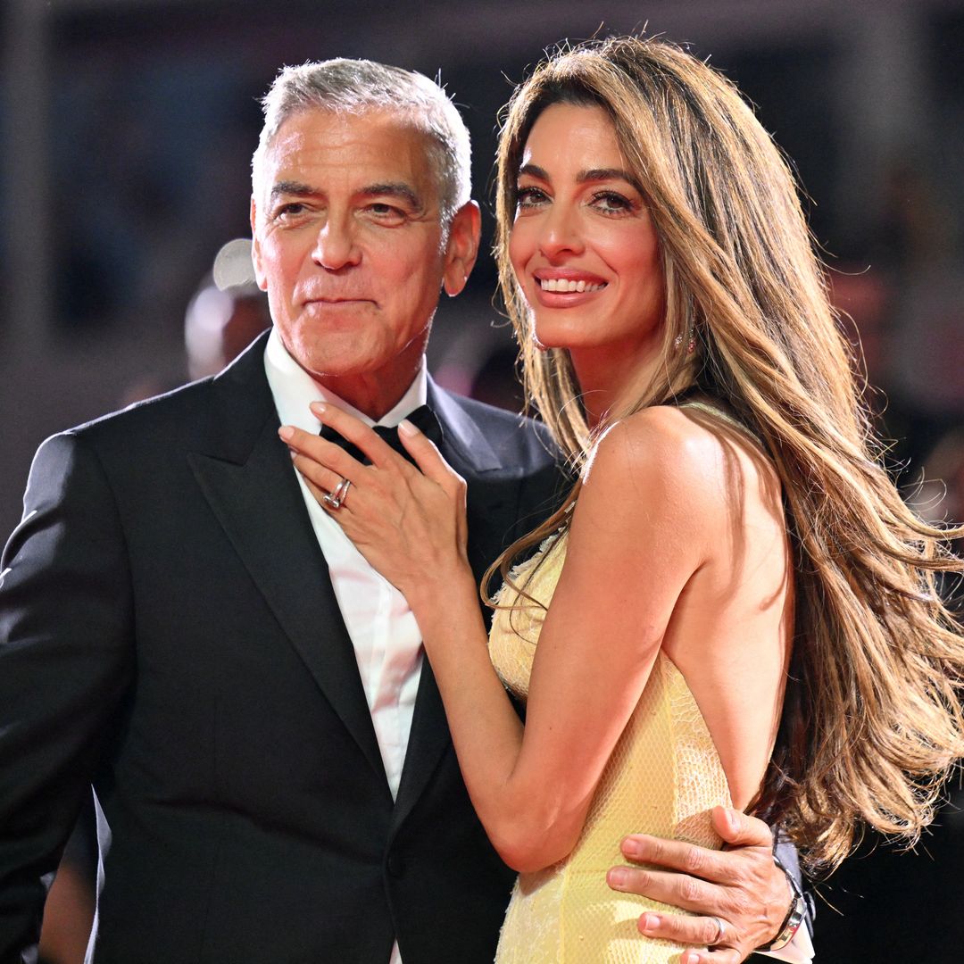 George Clooney is full of emotion in candid red carpet moment with wife Amal at 'Wolfs' premiere