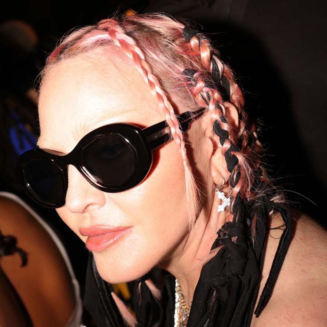 Madonna, 64, drops jaws in cutout leather bandage dress and Barbie-pink hair