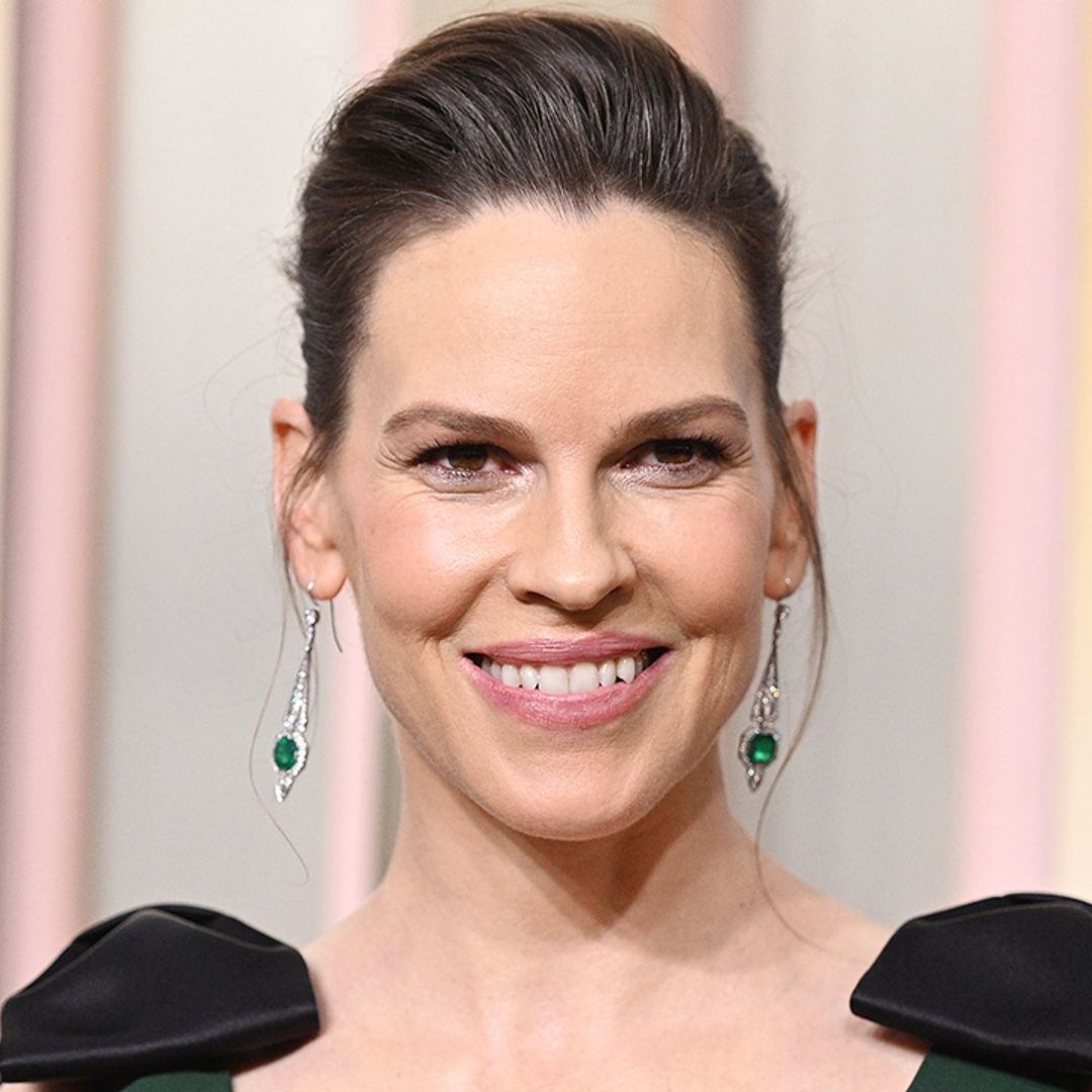 Glowing Hilary Swank looks beautiful in bump-enhancing gown at the Golden Globes