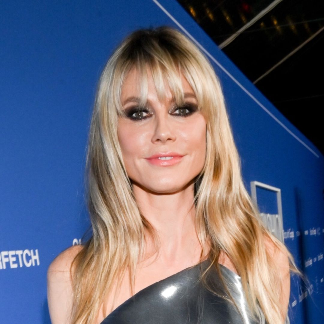 Heidi Klum's liquid metallic dress is one for the ages – and check out her quirky accessory