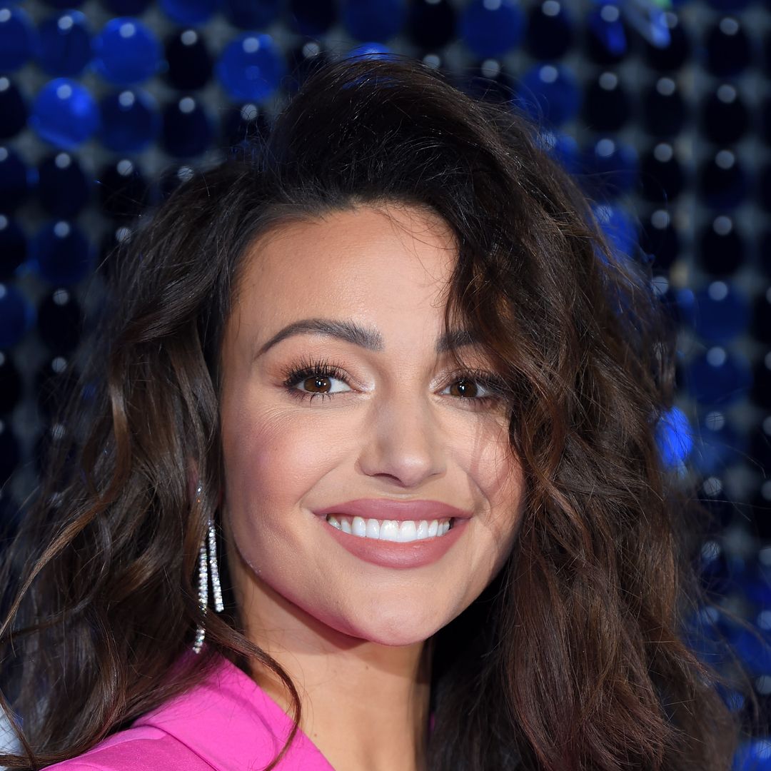 Michelle Keegan turns up the heat in daring crop top and high-waisted trousers in stunning new photos