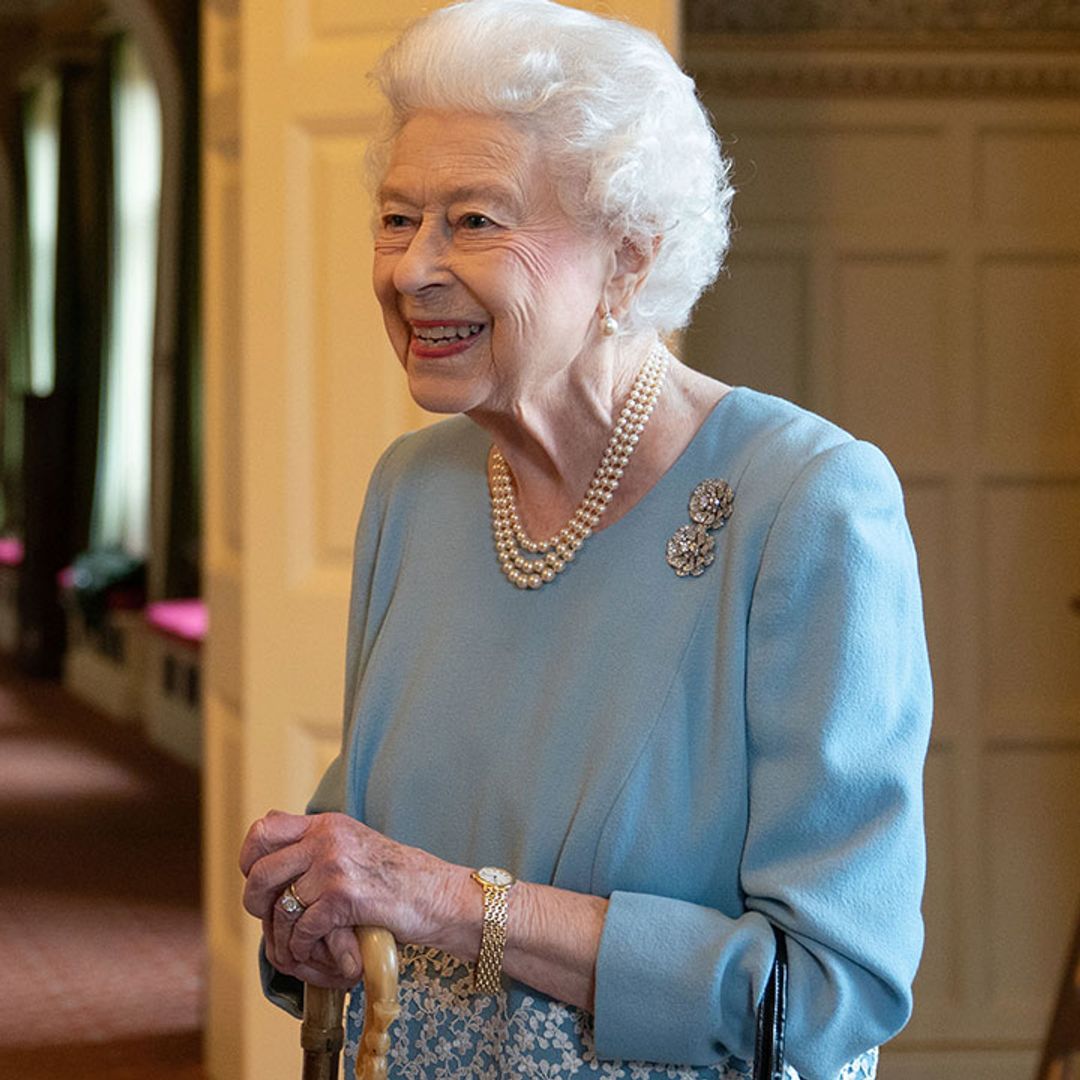 The Queen uses Prince Philip's walking stick at Sandringham tea party