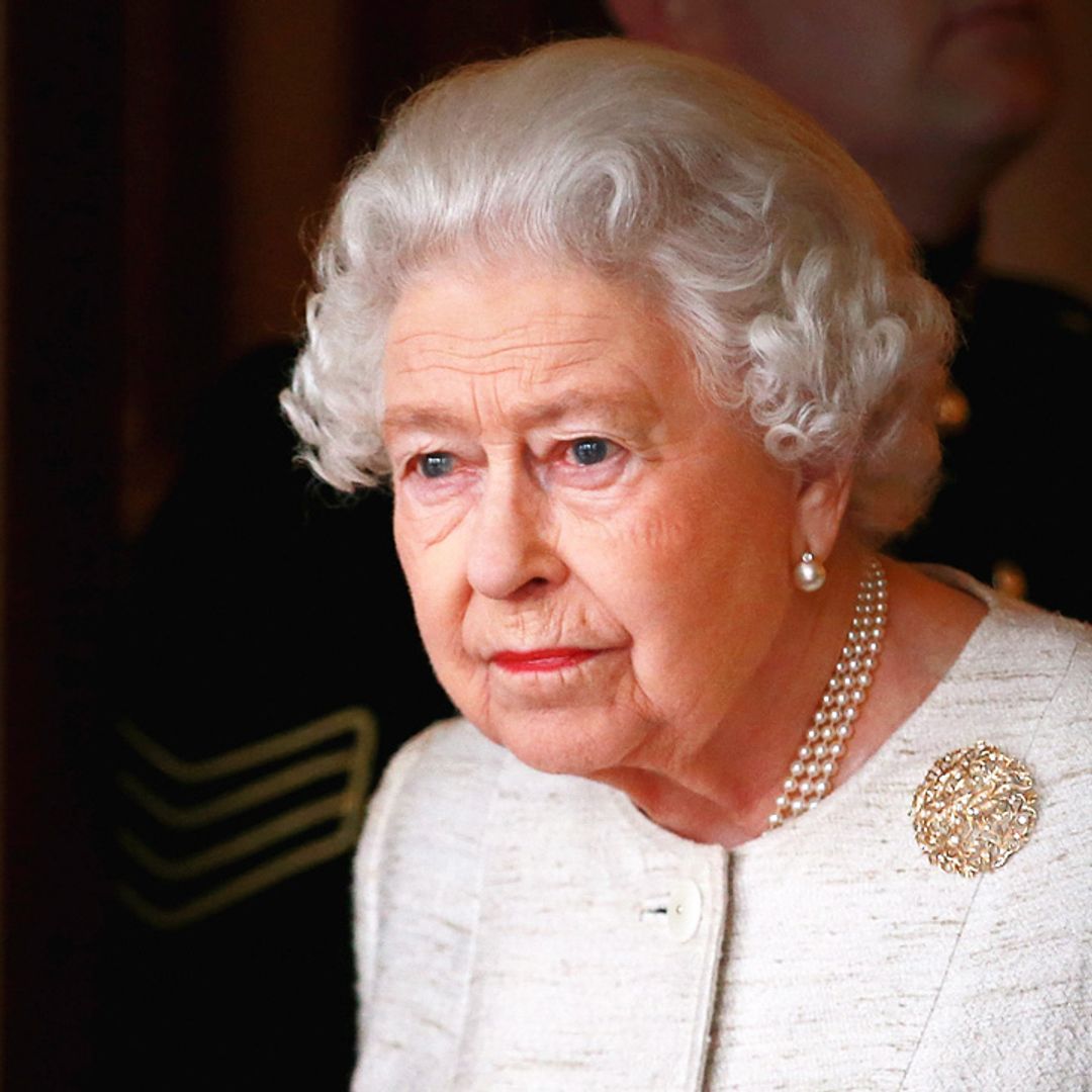 The Queen appears full of emotion as she watches poignant family tribute