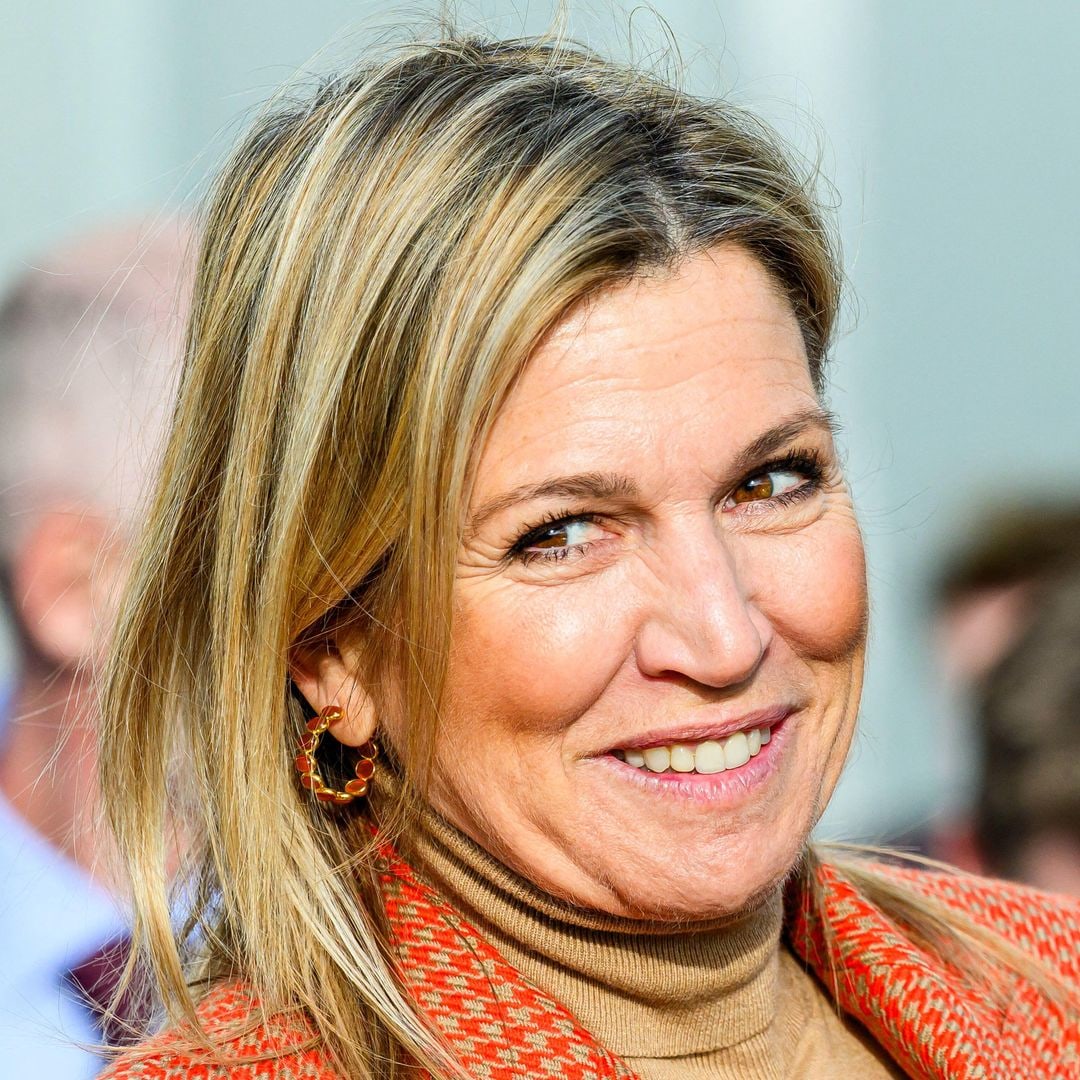 Queen Maxima is a 'burst of cheer' in waist-cinching orange look – and Mango bag