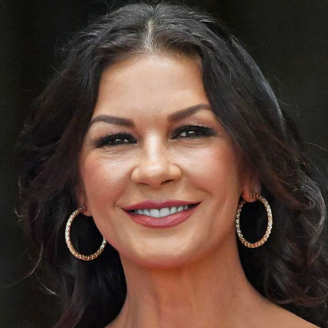Catherine Zeta-Jones commands attention in ab-baring workout gear to reveal exciting news