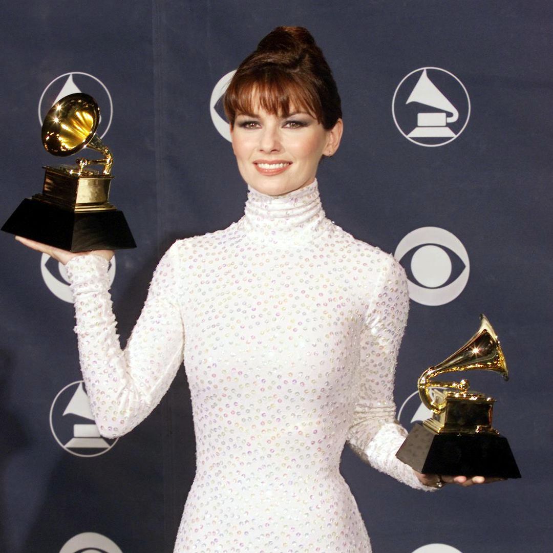 Country music star Shania Twain poses with her two Grammys for Best Country Song and Best Female Country Vocal Performance at the 41st Annual Grammy Awards in Los Angeles, 24 February.