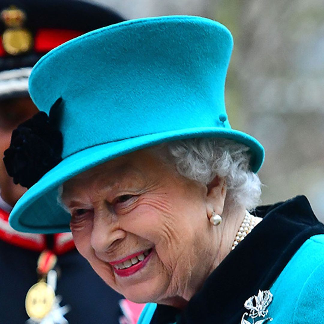 The Queen brings the festive joy in terrific turquoise outfit on charity visit