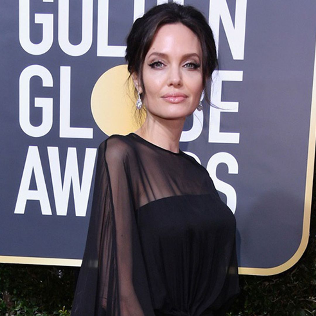 Angelina Jolie attends the Golden Globes with son Pax as her date